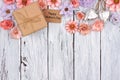 Paper flowers top border with Mother`s Day gift and tag over wood Royalty Free Stock Photo