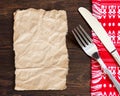 Paper, fork and knife on kitchen towel Royalty Free Stock Photo