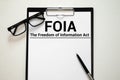 Paper with The Freedom of Information Act FOIA on a table Royalty Free Stock Photo