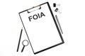 Paper with The Freedom of Information Act FOIA on a table Royalty Free Stock Photo