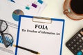 Paper with The Freedom of Information Act FOIA on a table Royalty Free Stock Photo