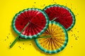 Paper fruit origami watermelon fan decoration close up on bright yellow background. Tropics summer