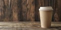 A paper glass of coffee with a lid stands on a wooden table Royalty Free Stock Photo