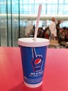 A paper glass of Pepsi brand soft drink in a KFC outlet