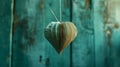 Paper heart hanging on string against turquoise wooden background for Valentines day Royalty Free Stock Photo