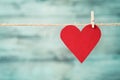 Paper heart hanging on string against turquoise wooden background for Valentines day Royalty Free Stock Photo