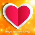 Paper heart isolated on shiny orange background.