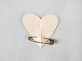 Paper heart with metal safety pin on white background Royalty Free Stock Photo