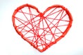 paper heart tied with red threads. Heart on a white background.
