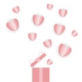 Paper hearts fly out of the gift box. Pink paper hearts on a white background with a shadow. Royalty Free Stock Photo