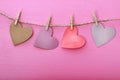 Paper hearts hanging from string with clothespins Royalty Free Stock Photo