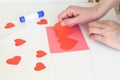 Paper hearts over the background with paper cut shapes. Saint Valentine, mother& x27;s day, birthday greeting cards