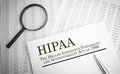 Paper with HIPAA The Health Insurance Portability and Accountability Act of 1996 on a table Royalty Free Stock Photo