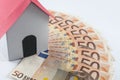 Paper house on a fifty euros banknote fan: mortgage and loan con Royalty Free Stock Photo