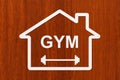 Paper house with GYM text inside. Abstract sport conceptual image