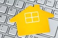 Paper house icon on the computer keyboard Royalty Free Stock Photo