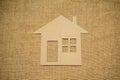 Paper house on sackcloth