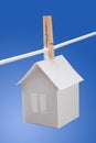 Paper house on washing line Royalty Free Stock Photo