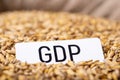 Paper with inscription GDP on barley grain