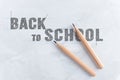 Paper with inscription word BACK TO SCHOOL near wooden pencil Royalty Free Stock Photo