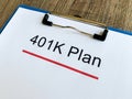 Paper with 401k plan on wood table Royalty Free Stock Photo