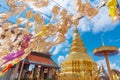 Paper lantern hanging festival with golden pagoda background at Wat Phra That Hariphunchai Lamphun