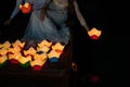 Paper lantern in Vietnamese woman hand in Hoi An ancient town, Vietnam. The lanterns are set into the river as an offering and to Royalty Free Stock Photo