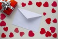 Paper letter envelope with a present box gift with hearts around Royalty Free Stock Photo
