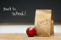 Paper lunch bag on desk Royalty Free Stock Photo