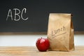 Paper lunch bag on desk Royalty Free Stock Photo