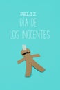 Paper man and text happy innocents day in spanish