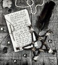 Paper manuscript with hand written text, pentagram and quill on planks in black tone