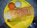 Paper Masala dosa is a South Indian meal served with sambhar and coconut chutney over fresh banana leaf. Royalty Free Stock Photo