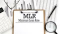 Paper with MLR - Minimum Loan Rate a table on charts, business concept