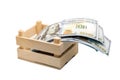 Paper money lies in a small wooden box, isolated, white Royalty Free Stock Photo