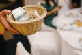 Paper money in a wooden basket close up