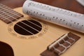 Paper music on guitar instrument