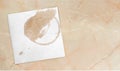 Paper Napkin with a coffee circle on background Royalty Free Stock Photo