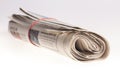 Rolled up newspapers close up on light background