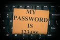 Paper note with easy password on black computer keyboard Royalty Free Stock Photo