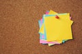 Paper note pad reminder sticky notes pin paper yellow on cork bulletin board Royalty Free Stock Photo