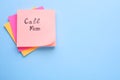 Paper note with phrase Call mom on light blue background, top view. Space for text Royalty Free Stock Photo