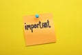 Paper note with word Important pinned on yellow background Royalty Free Stock Photo