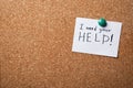 Paper note with words I NEED YOUR HELP on cork board Royalty Free Stock Photo