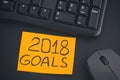Paper note with writing 2018 Goals on a desk with black keyboard Royalty Free Stock Photo