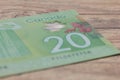 Paper notes from Canada. Dollar. Bils on wood rustic table Royalty Free Stock Photo
