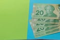 Paper notes from Canada. Dollar. Bills on colorful bright table