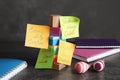 Paper notes with different baby names, toys and notebooks on grey table Royalty Free Stock Photo
