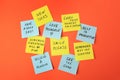 Paper notes with life-affirming phrases on orange background