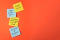 Paper notes with life-affirming phrases on orange background. Space for text